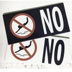 Pool safety tiles displaying custom warning messages in matching glazed porcelain finish.